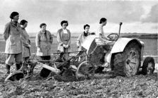 British girls of the Women's Land Army learning to plough with a tractor, World War II, 1939-1945