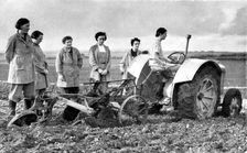 British girls of the Women's Land Army learning to plough with a tractor, World War II, 1939-1945