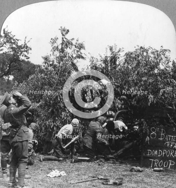 British gunners donning masks as protection against German gas shells, World War I, c1914-c1918. Artist: Realistic Travels Publishers