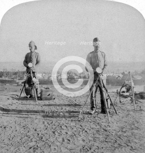 British heliographing from the Johannesburg Fort the news of the occupation, Boer war, 1900. Artist: Underwood & Underwood