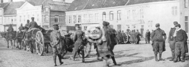British horse-drawn artillery in a Belgian village, August 1914. Artist: Unknown