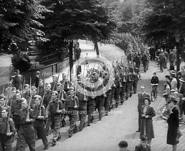British Local Defence Volunteers Marching in Parade, 1940. Creator: British Pathe Ltd.