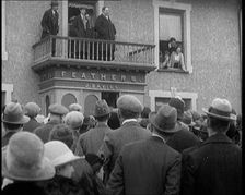 British Man Speaking to a Crowd from the Balcony of a Building Marked Feathers J. Davies..., 1921. Creator: British Pathe Ltd