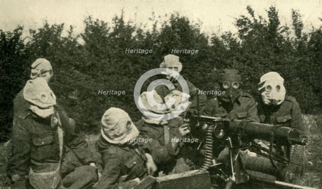 '...British Machine-gun Section wearing anti-gas masks', First World War, 1914-1918, (c1920). Creator: Unknown.