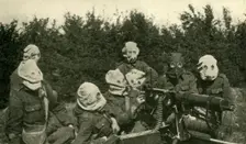 ...British Machine-gun Section wearing anti-gas masks First World War, 1914-1918, (c1920). Creator: Unknown