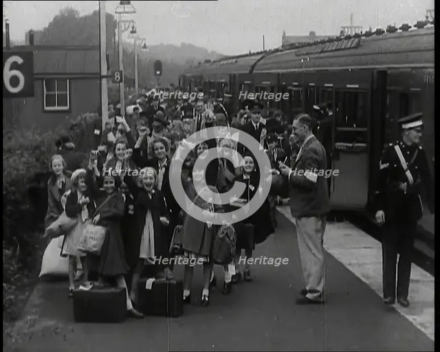 British Male and Female Evacuees on the Platform of a Small Station in the British Country..., 1939. Creator: British Pathe Ltd.