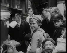 British Male and Female Evacuees Waiting to Board a Bus With Two Male Bus Staff Standing..., 1939. Creator: British Pathe Ltd