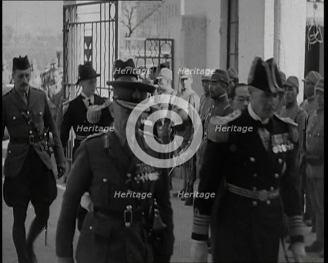 British Military Leaders Walking Through a Gate of Official Building in Shanghai to..., 1937. Creator: British Pathe Ltd.