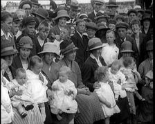 British Mothers Sitting With Their Babies on Their Laps at a Baby Show, 1920. Creator: British Pathe Ltd