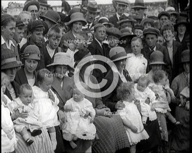 British Mothers Sitting With Their Babies on Their Laps at a Baby Show, 1920. Creator: British Pathe Ltd.