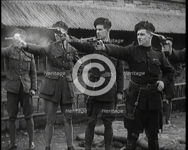 British Officers Firing Revolvers at Targets, 1921. Creator: British Pathe Ltd.