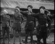 British Officers Firing Revolvers at Targets, 1921. Creator: British Pathe Ltd