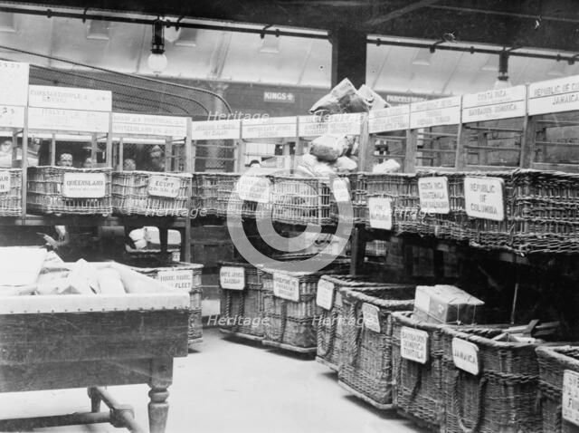 British Parcels Post-sorting parcels for foreign mail, between c1910 and c1915. Creator: Bain News Service.