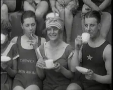 British People Sitting Around and Drinking Cups of Tea While Wearing Bathing Suits at the.., 1920. Creator: British Pathe Ltd