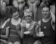 British People Sitting Around and Drinking Cups of Tea While Wearing Bathing Suits at the.., 1920. Creator: British Pathe Ltd