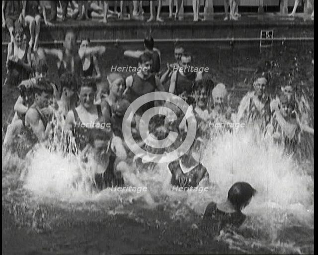 British People Splashing and Playing in the Chiswick Open Air Baths, 1920. Creator: British Pathe Ltd.