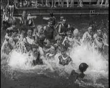 British People Splashing and Playing in the Chiswick Open Air Baths, 1920. Creator: British Pathe Ltd