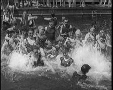 British People Splashing and Playing in the Chiswick Open Air Baths, 1920. Creator: British Pathe Ltd