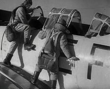 British Pilots Entering a Fighter Plane, 1941. Creator: British Pathe Ltd