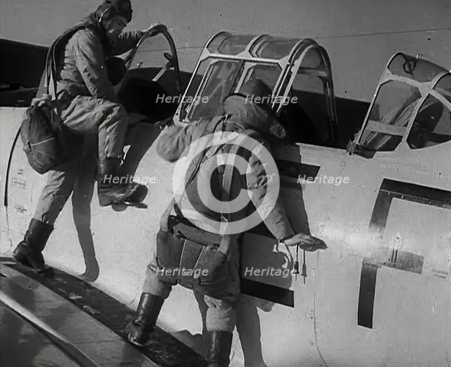 British Pilots Entering a Fighter Plane, 1941. Creator: British Pathe Ltd.