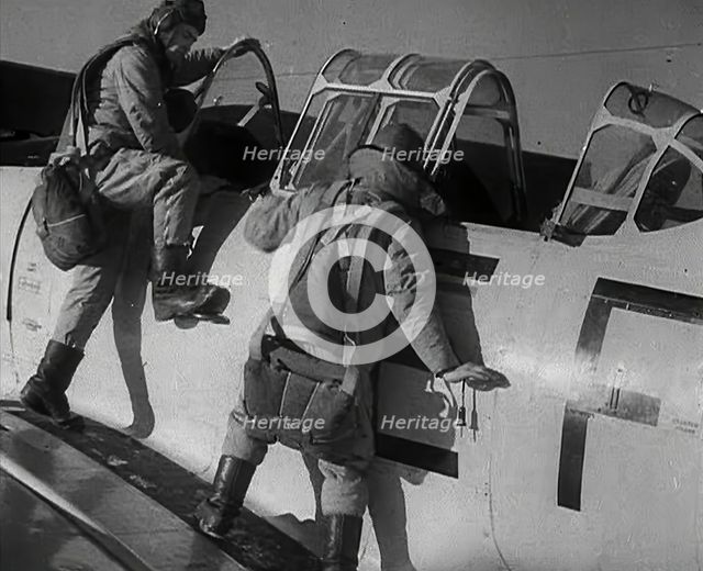 British Pilots Entering a Fighter Plane, 1941. Creator: British Pathe Ltd.