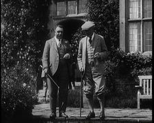 British Prime Minister Ramsay MacDonald Exits the Door of Chequers Holding a Stick..., 1924. Creator: British Pathe Ltd