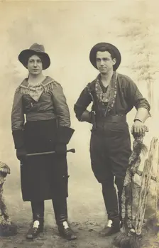 British prisoners of war in cowboy and cowgirl costumes posing at...(1910 - 1919?). Creator: Paul Tharan
