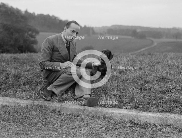 British racing driver Charles Mortimer and his pet dachshund, c1930s Artist: Bill Brunell.