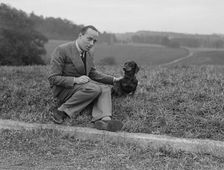 British racing driver Charles Mortimer and his pet dachshund, c1930s Artist: Bill Brunell