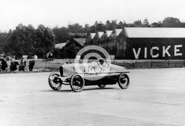 British racing driver George Bedford driving a Hillman at Brooklands, Surrey, 1921. Creator: Unknown.