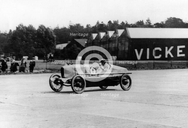 British racing driver George Bedford driving a Hillman at Brooklands, Surrey, 1921. Creator: Unknown.