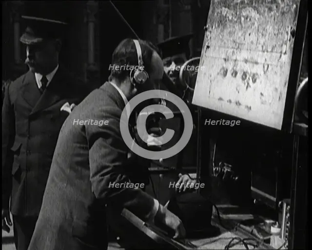 British Radio Operator Working at the Rear of a Fire Engine, 1920. Creator: British Pathe Ltd.