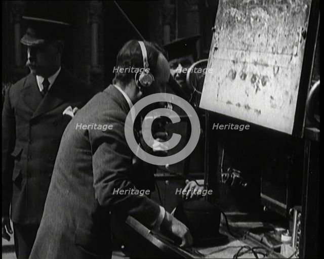 British Radio Operator Working at the Rear of a Fire Engine, 1920. Creator: British Pathe Ltd.