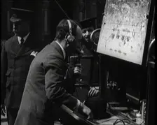 British Radio Operator Working at the Rear of a Fire Engine, 1920. Creator: British Pathe Ltd