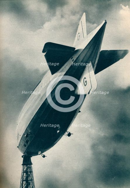 British rigid airship R101 riding at her mooring mast at Cardington, Bedfordshire, c1929 (c1937). Artist: Unknown.