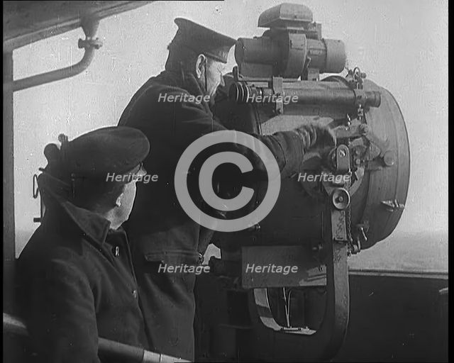 British Royal Navy Officer Looking Through a Telescope With a Searchlight at  the Norwegian..., 1940 Creator: British Pathe Ltd.