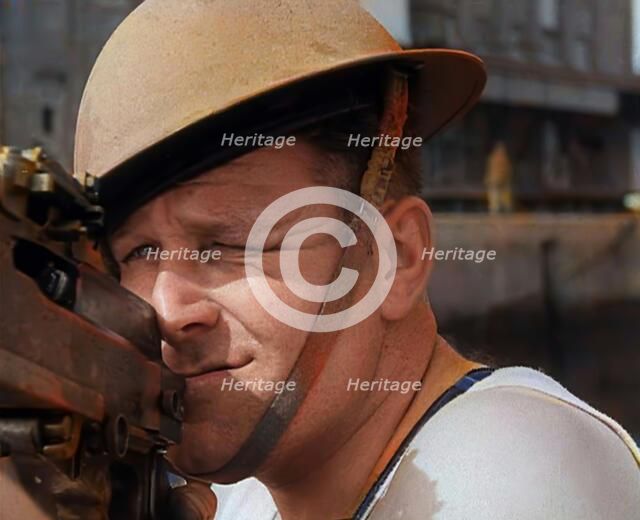 British Sailors Mounting Machine Guns To Small Boats for the Dunkirk Evacuation, 1940. Creator: British Pathe Ltd.