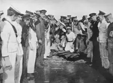British sailors round a hole in the deck of their vessel 1915