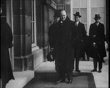 British Secretary of State for the Colonies Winston Churchill Exiting a Building, 1921. Creator: British Pathe Ltd
