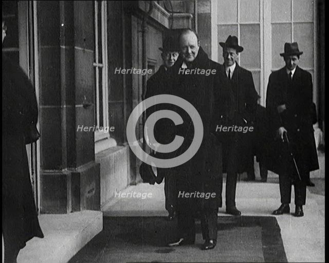 British Secretary of State for the Colonies Winston Churchill Exiting a Building, 1921. Creator: British Pathe Ltd.