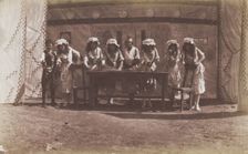 British servicemen in drag acting out a cooking class, 1918. Creator: Unknown