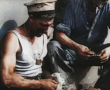 British Soldier Counting Bullets on Board a Ship Evacuating Him from Dunkirk, 1940. Creator: British Pathe Ltd