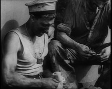 British Soldier Counting Bullets on Board a Ship Evacuating Him from Dunkirk, 1940. Creator: British Pathe Ltd