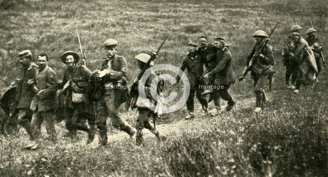 British soldiers with German prisoners of war, northern France, First World War, 1916, (c1920). Creator: Unknown.