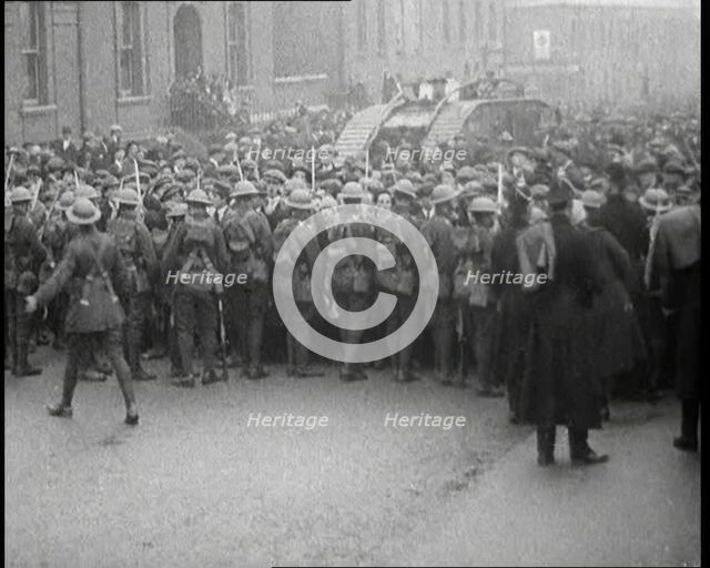 British Soldiers Holding Back Crowds of Demonstrators in Dublin as a Tank Moves Through to..., 1920. Creator: British Pathe Ltd.