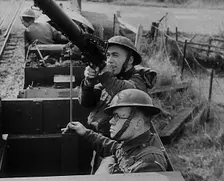 British Soldiers Manning a Machine Gun on an Improvised Armoured Miniature Train, 1940. Creator: British Pathe Ltd