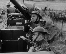 British Soldiers Manning a Machine Gun on an Improvised Armoured Miniature Train, 1940. Creator: British Pathe Ltd