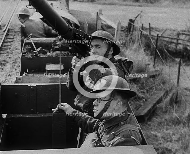 British Soldiers Manning a Machine Gun on an Improvised Armoured Miniature Train, 1940. Creator: British Pathe Ltd.
