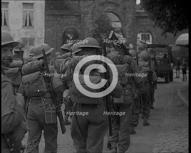 British Soldiers Marching Through a French Town, 1940. Creator: British Pathe Ltd.