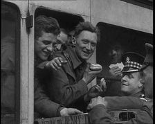 British Soldiers Receiving Food and Drink on the Train Back To Camp, 1940. Creator: British Pathe Ltd